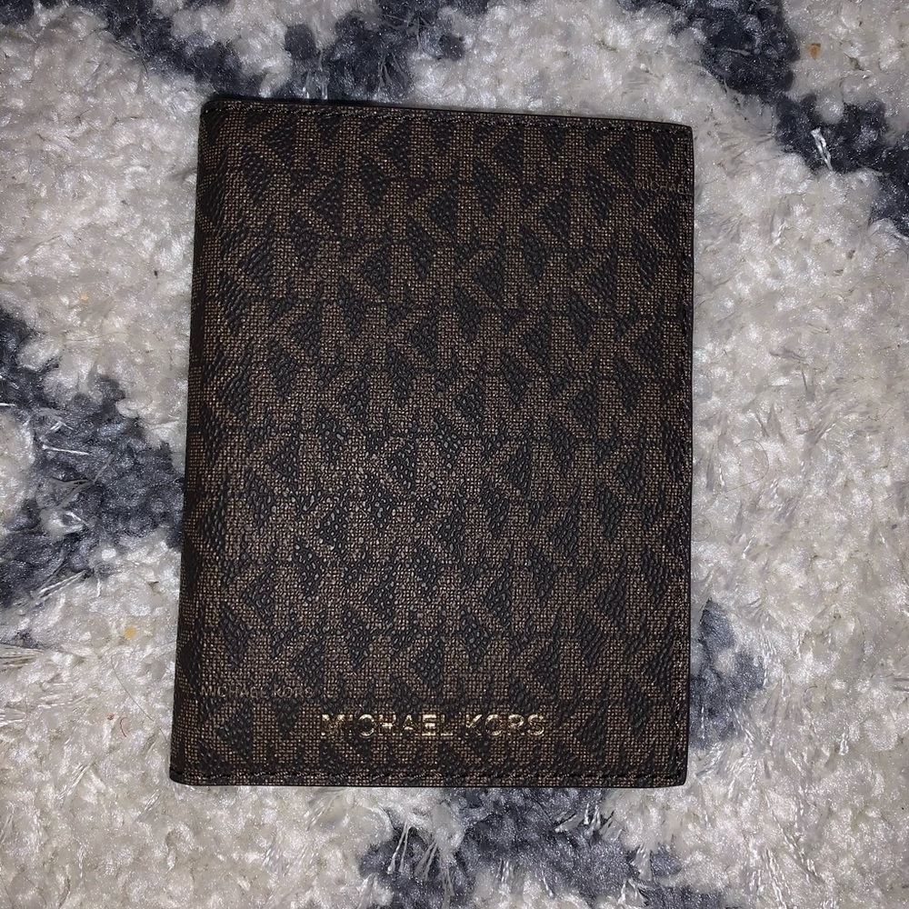 Michael Korrs passport ID holder